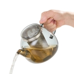 Красив стъклен чайник с филтър и поставка за подгряване